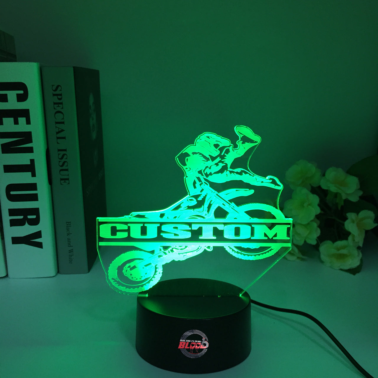 Personalized Motocross 3D LED Illusion Lamp featuring a custom name and racing number alongside a dirt bike rider silhouette, glowing in a vibrant orange on a black base.