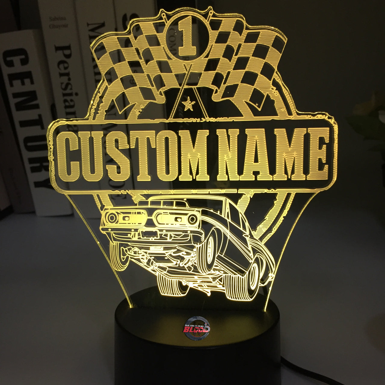 Personalized Super Stock Drag Racing 3D LED Illusion Lamp featuring a custom name and number alongside a wheel-standing muscle car silhouette, glowing in a vibrant blue on a black base.