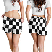 Premium women's athletic shorts featuring a bold checkered racing flag pattern, designed with an elastic drawstring waistband and functional side pockets.