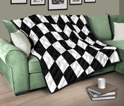 A black and white checkered quilted blanket in a living room