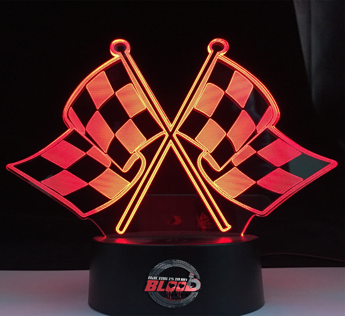 Racing Flag 3D LED Lamp featuring detailed crossed checkered flags glowing in a bright white on a modern black base.