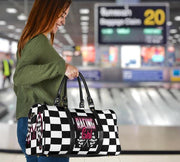 Woman holding a duffel bag with a pink racing girl and checkered flag design at an airport, customizable text.