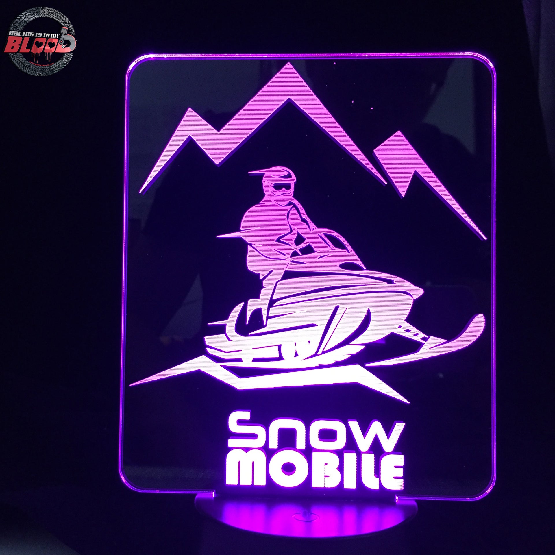 Snowmobile 3D LED Lamp featuring a detailed modern sled silhouette glowing in a vibrant icy white on a premium black base.