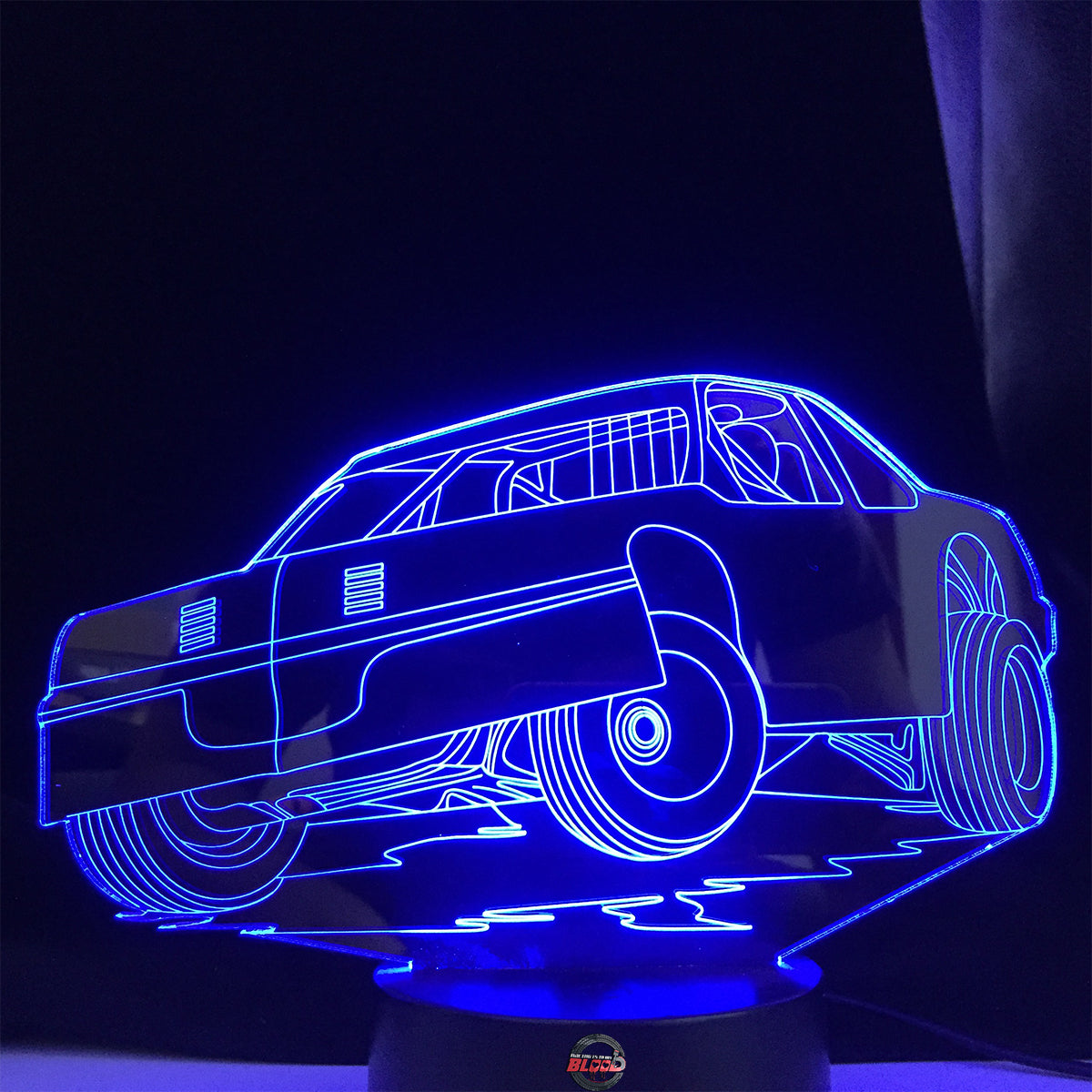 Street Stock 3D LED Lamp featuring a classic stock car silhouette glowing in a bright, race-ready green on a modern black base.
