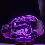 Street Stock 3D LED Lamp featuring a classic stock car silhouette glowing in a bright, race-ready green on a modern black base.