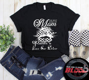 "The Best Kind Of Mom Raises A Race Car Driver" apparel collection featuring premium women's t-shirts, lightweight racerback tanks, and cozy fleece hoodies for racing families.