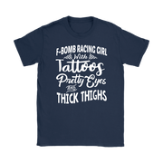 Women's F-Bomb Racing graphic apparel featuring the bold "Girl With Tattoos, Pretty Eyes, And Thick Thighs" slogan available in t-shirts, racerback tanks, and hoodies.