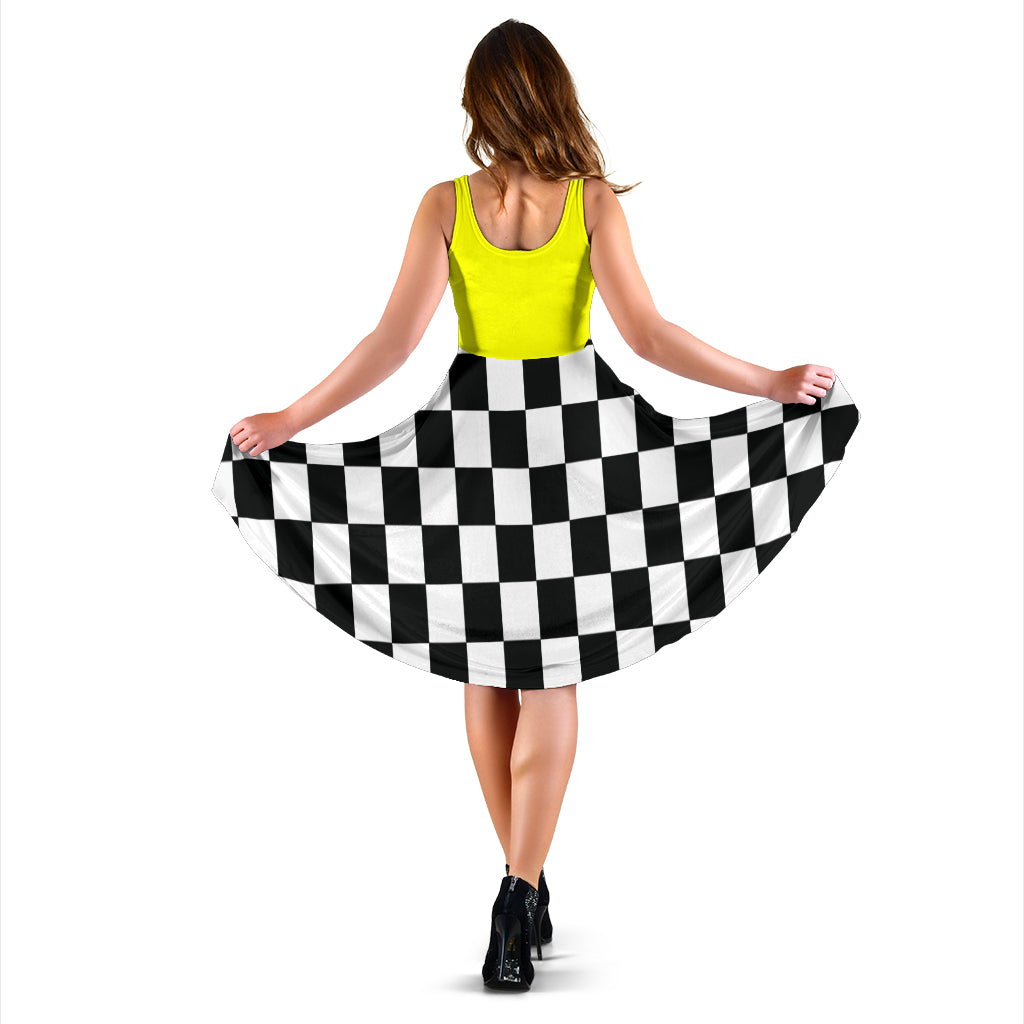 Women's midi dress featuring a mixed yellow and black checkered flag pattern, perfect for racing events and trackside fashion.