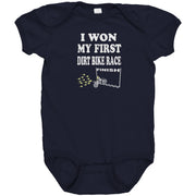 Cute baby onesies and toddler shirts featuring the "I Won My First Dirt Bike Race" graphic, crafted from ultra-soft ringspun cotton for future motocross champions.